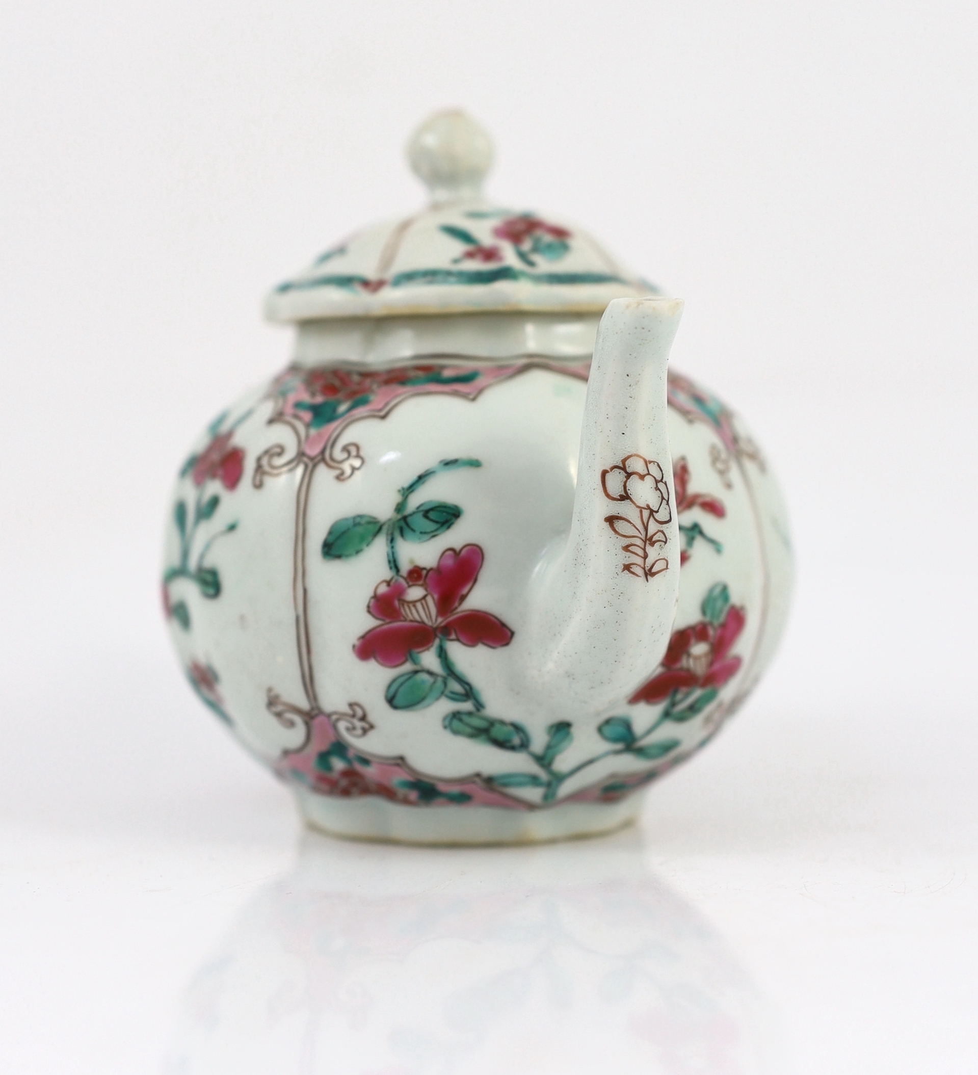 A Chinese famille rose petal lobed teapot, Yongzheng period, minor faults